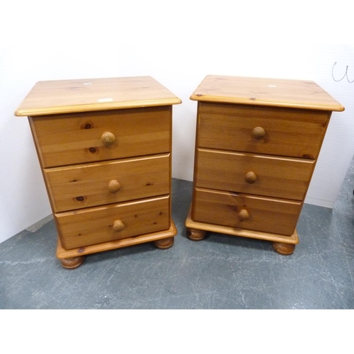 366 - Pair of pine three-drawer bedside chests.