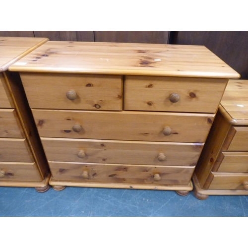 391 - Pine dressing table, chest of drawers and a bedside chest.