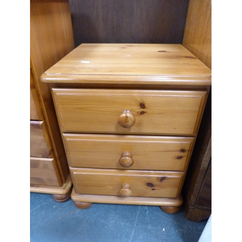 391 - Pine dressing table, chest of drawers and a bedside chest.