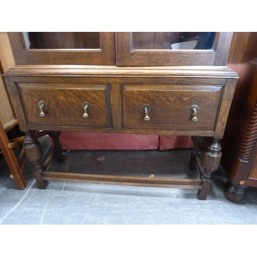 421 - Oak two-door bookcase cabinet.