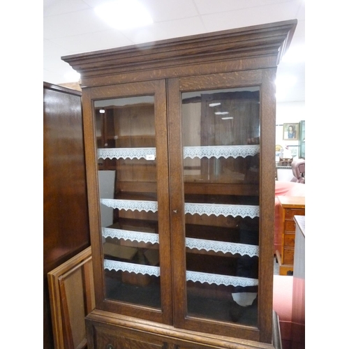 421 - Oak two-door bookcase cabinet.