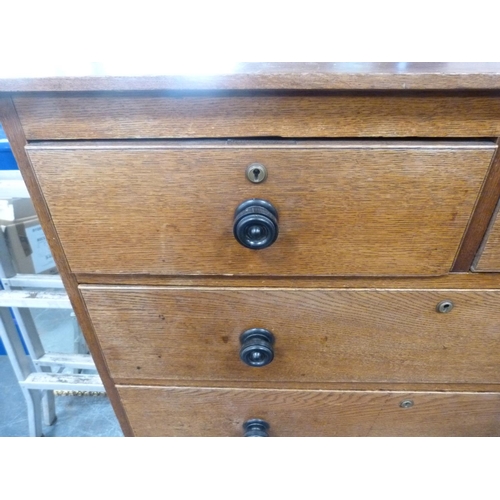 428 - Oak chest of two short and three long drawers.