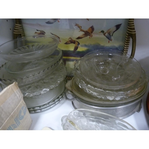 46 - Assorted kitchen glassware including bowls, cake stands and other various items.