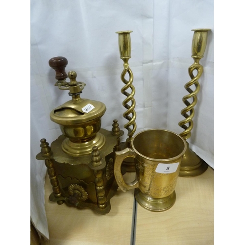 5 - Brass spice grinder, pair of candlesticks and a tankard.