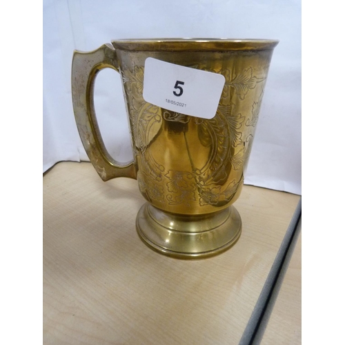 5 - Brass spice grinder, pair of candlesticks and a tankard.