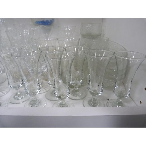 72 - Large quantity of glasses including wine, shot, and vases.