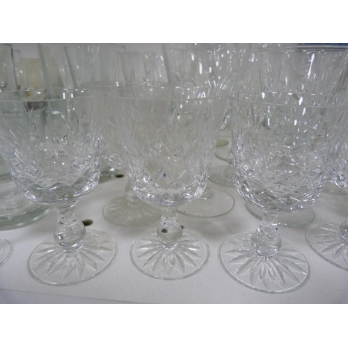 72 - Large quantity of glasses including wine, shot, and vases.