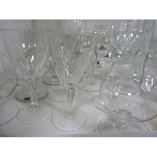 72 - Large quantity of glasses including wine, shot, and vases.