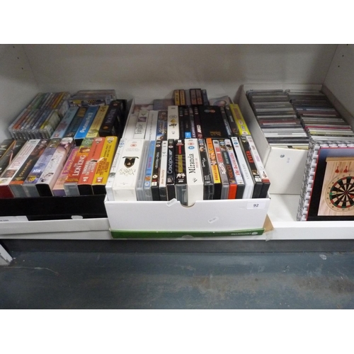 92 - Assorted DVDs, CDs and VHS cassettes.