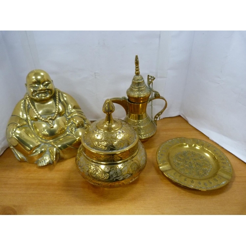 94 - Assorted brassware including Buddha, kettle, oversized key, Irish Guards belt buckle etc.