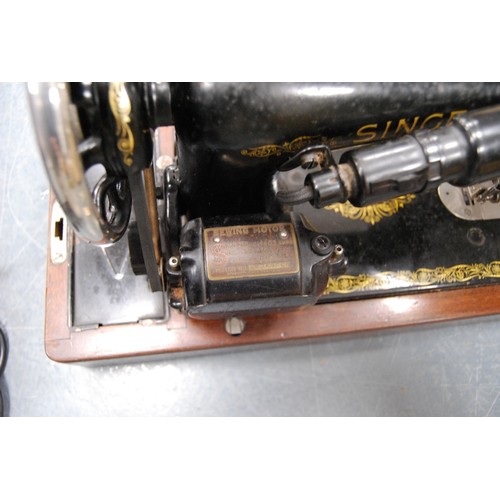 154 - Singer sewing machine.