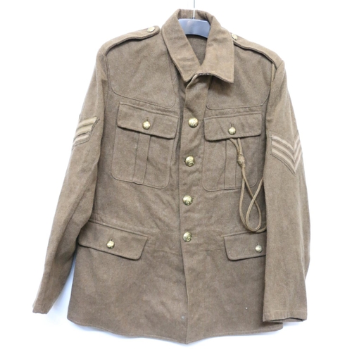 1138 - British Army uniform, a British Army khaki green battledress jacket with worn label having brass GRV... 