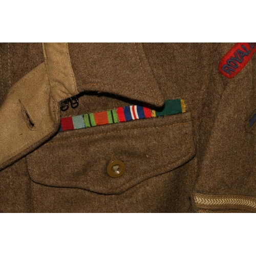 1145 - British Army uniform, a British Army khaki green battledress jacket with Askett Limited label 