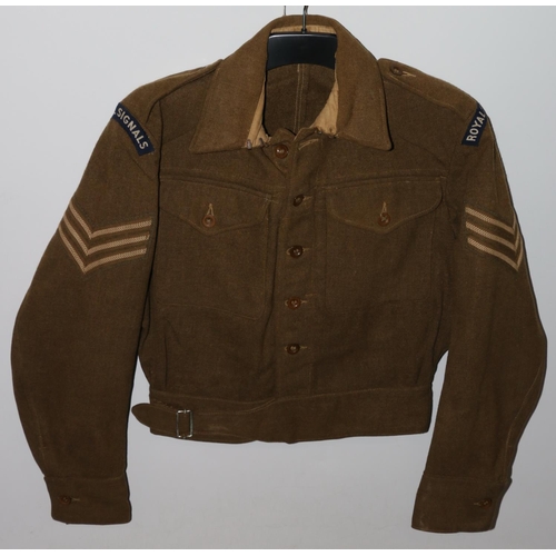 1146 - British Army uniform, a British Army khaki green battledress jacket with worn label having two cloth... 