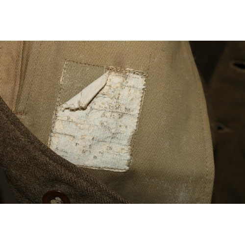 1146 - British Army uniform, a British Army khaki green battledress jacket with worn label having two cloth... 