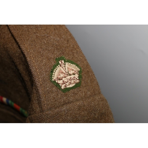 1147 - British Army uniform, a British Army khaki green battledress jacket with London Bros Ltd label 