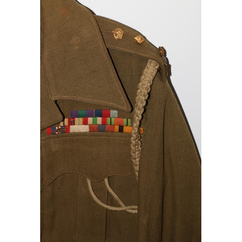 1149 - British Army uniform, a British Army khaki green jacket having two NF (Northumberland Fusiliers) epa... 