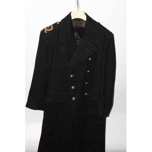 1151 - British Navy uniform, a black greatcoat with brass naval buttons, bullion wire epaulette rank insign... 