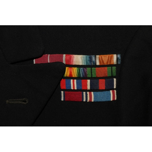 1153 - British Naval uniform, a Royal Navy black jacket with Wing Cheung of Hong Kong label having bullion ... 