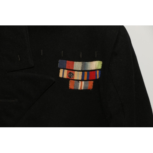 1154 - British Naval uniform, a Roya Navy black jacket having Gieves Ltd brass anchor buttons, lower sleeve... 