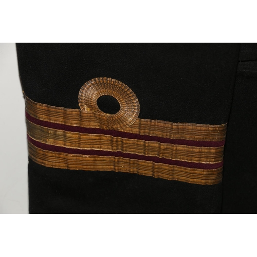 1154 - British Naval uniform, a Roya Navy black jacket having Gieves Ltd brass anchor buttons, lower sleeve... 