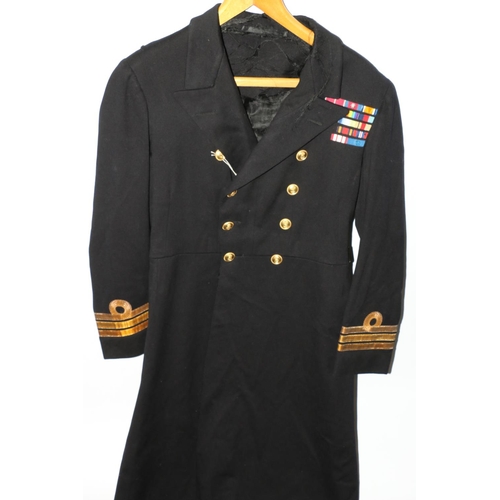 1155 - British Naval uniform, a Royal Navy greatcoat with Gieves Ltd label 