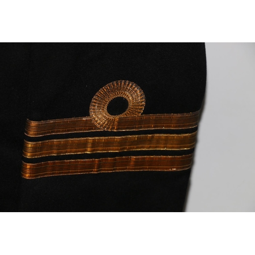 1155 - British Naval uniform, a Royal Navy greatcoat with Gieves Ltd label 