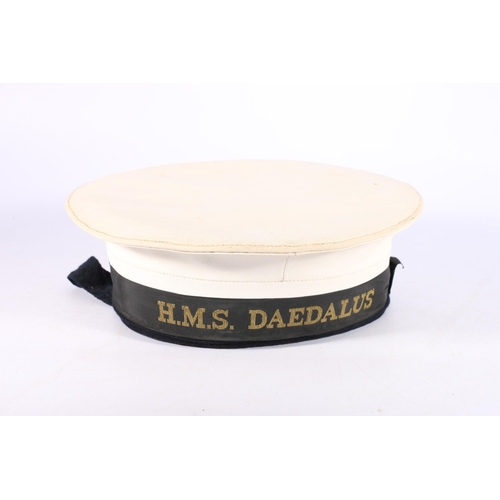 1156 - British Navy uniform, a white sailor's hat with HMS DAEDALUS tally