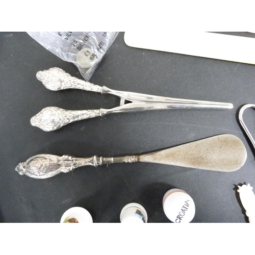 296 - Silver handled shoe horn, collectors' spoons, mixed coins and porcelain thimbles.