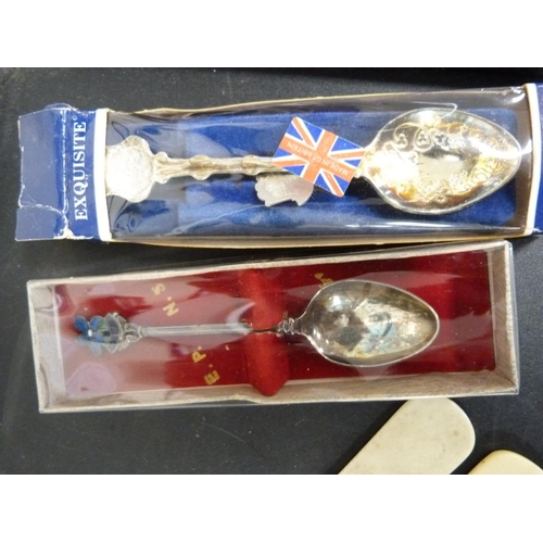 296 - Silver handled shoe horn, collectors' spoons, mixed coins and porcelain thimbles.