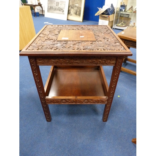 442 - Carved oak two-tier table depicting thistles.