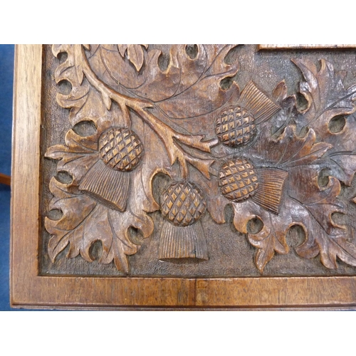 442 - Carved oak two-tier table depicting thistles.