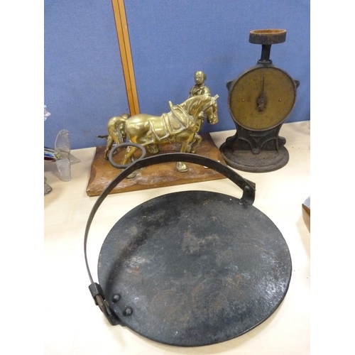 7 - Brass model of a blacksmith, set of Salter scales and a griddle.