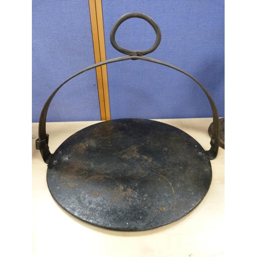 7 - Brass model of a blacksmith, set of Salter scales and a griddle.