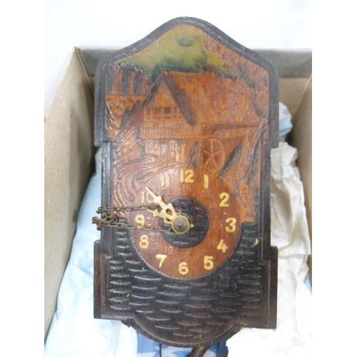 9 - Two mantel clocks, one wall clock and a box camera.