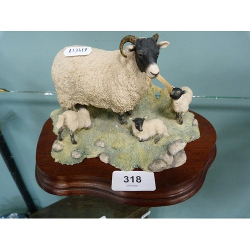 318 - Border Fine Arts figure of a sheep with three lambs.