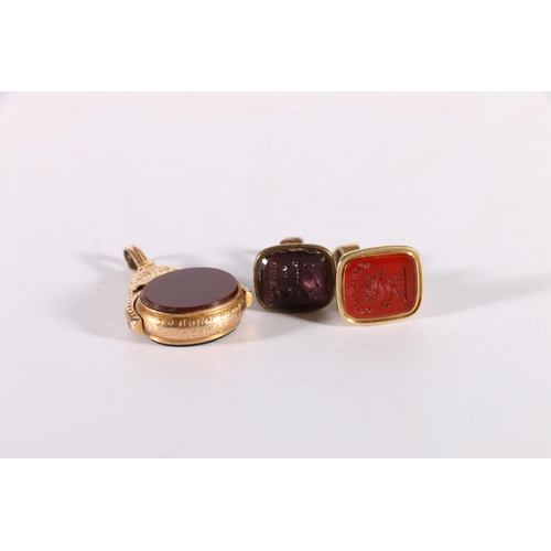 127 - Three unhallmarked fobs, the first with intaglio carved agate with 