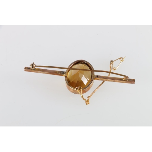 170 - 9ct gold bar brooch set with large faceted oval citrine stone, 13.6g gross, 8cm long
