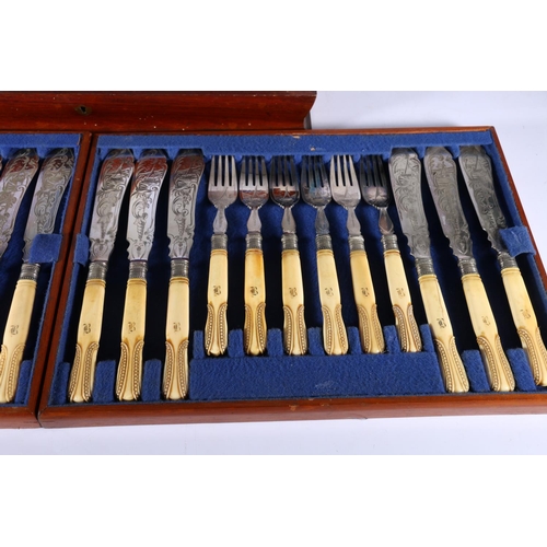 65 - Canteen of eighteen fish knives and forks with engraved blades decorated with sailing boat having ca... 