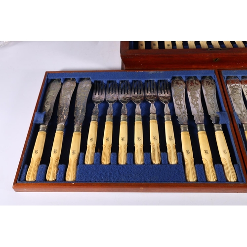 65 - Canteen of eighteen fish knives and forks with engraved blades decorated with sailing boat having ca... 