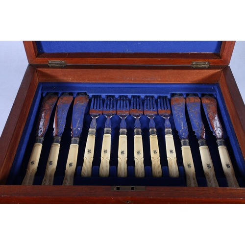 65 - Canteen of eighteen fish knives and forks with engraved blades decorated with sailing boat having ca... 