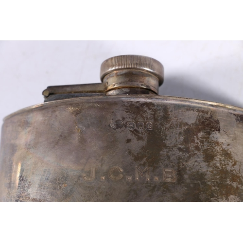 76 - An Art Deco period silver hip spirit flask of crescent moon shape by Goldsmiths and Silversmiths Com... 