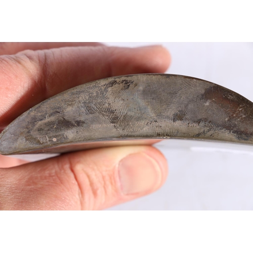 76 - An Art Deco period silver hip spirit flask of crescent moon shape by Goldsmiths and Silversmiths Com... 