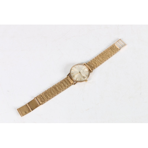 93 - Gents 9ct gold Omega wristwatch, (Cal 562), silvered dial with applied baton markers and 9ct gold br... 