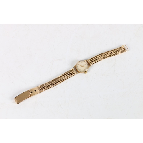 97 - Ladies 9ct gold Omega wristwatch, (Cal 244), the 9ct gold strap having unusual fastening clasp. Vint... 