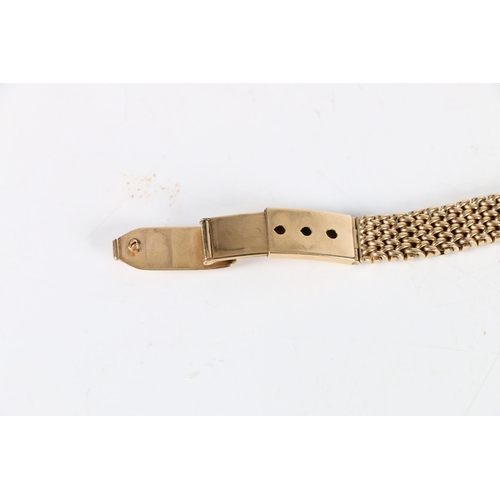 97 - Ladies 9ct gold Omega wristwatch, (Cal 244), the 9ct gold strap having unusual fastening clasp. Vint... 