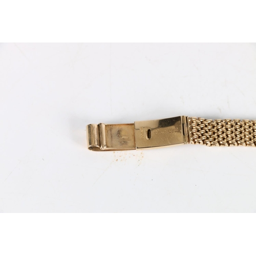 97 - Ladies 9ct gold Omega wristwatch, (Cal 244), the 9ct gold strap having unusual fastening clasp. Vint... 