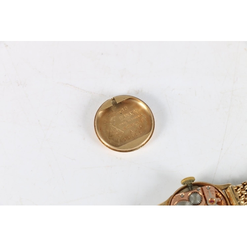 97 - Ladies 9ct gold Omega wristwatch, (Cal 244), the 9ct gold strap having unusual fastening clasp. Vint... 