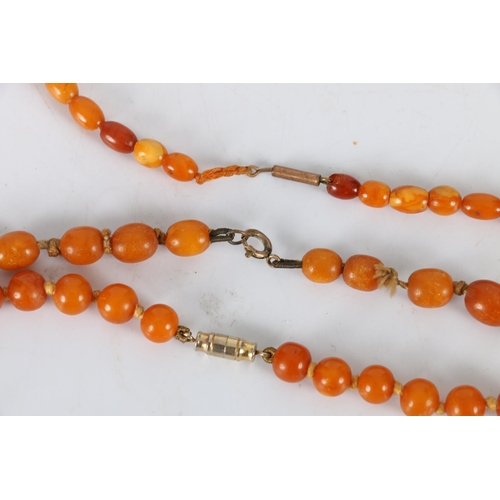150B - Three strands of amber style beads, 66g gross