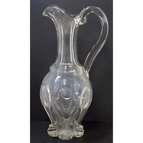 243 - Late 19th/early 20th century water jug of ovoid form with reeded handle and etched decoration of but... 